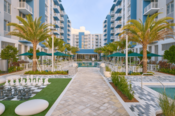 Resort-style pool & spa w/ lush landscape & cabanas